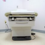 a hospital room with a bed and a charger