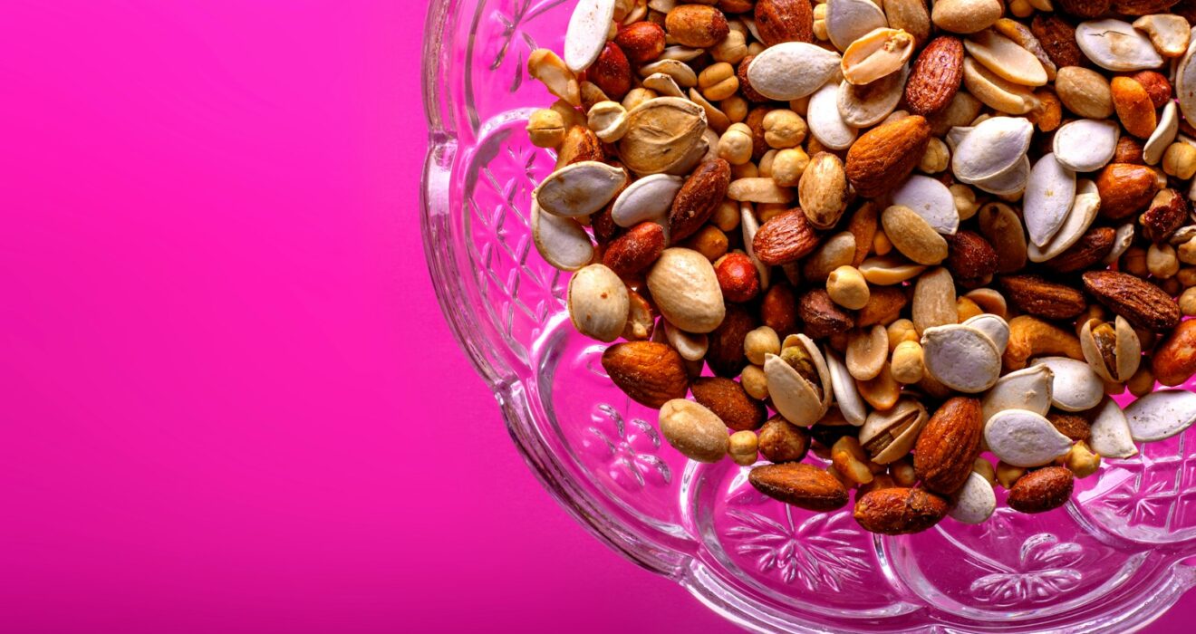 brown almond nuts on clear glass bowl