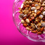 brown almond nuts on clear glass bowl