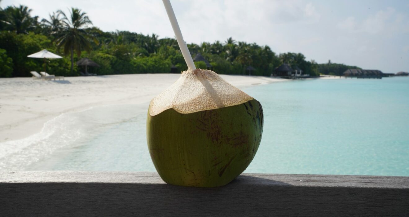coconut fruit on brown wooden table