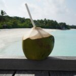 coconut fruit on brown wooden table