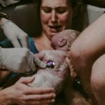 a person holding a baby