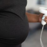 a person holding a video game controller